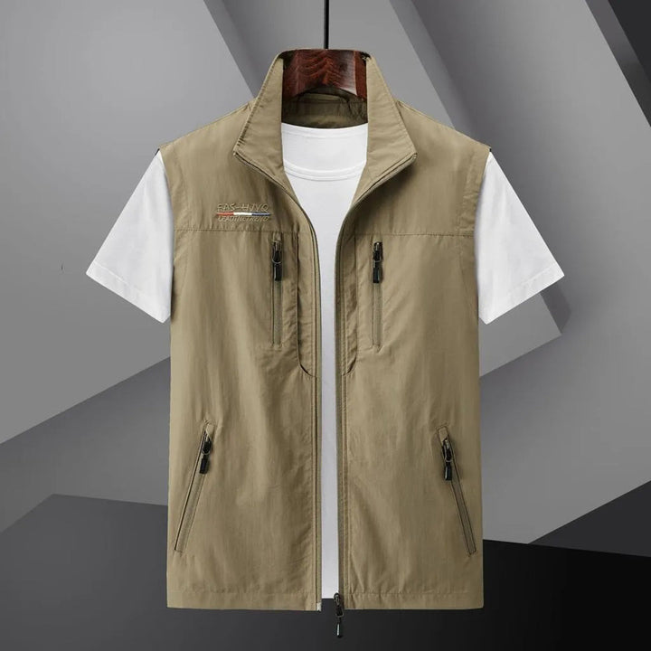 Durable men's fishing & hiking utility vest with multiple secure zip pockets for outdoor gear.