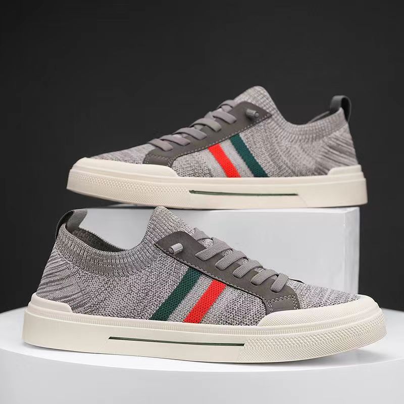 Front view of modern men's cushioned athletic sneakers, lightweight & breathable for versatile daily footwear.