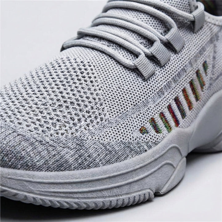 Close-up of men's lightweight trainers, highlighting the breathable mesh upper for comfort.