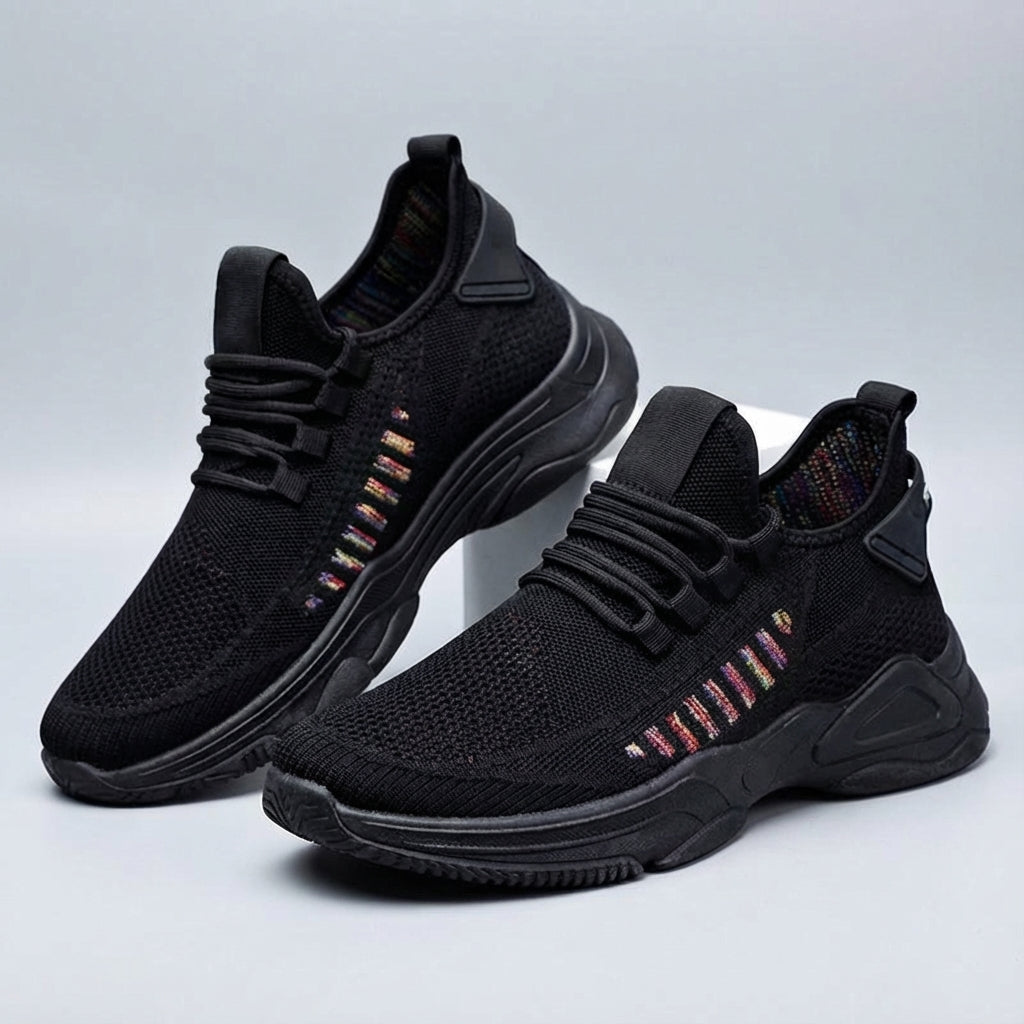 Side view of men's athletic running shoes, offering comfort and support for outdoor sports.