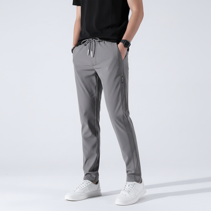 Detail of elastic waistband and drawstring on breathable men's jogging trousers for secure fit