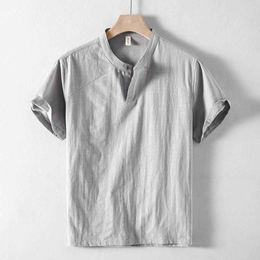 Front view of a men's long sleeve lightweight button-down shirt in light blue, casual summer wear.