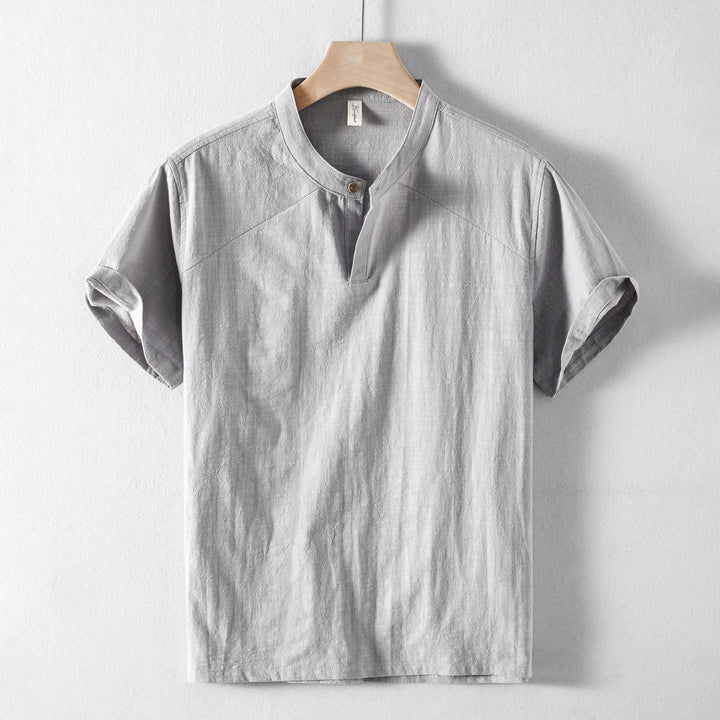 Front view of a men's long sleeve lightweight button-down shirt in light blue, casual summer wear.