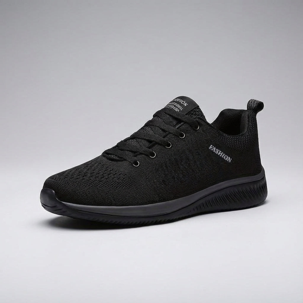 Close-up of breathable mesh upper on men's Dynamic Comfort leisure shoes, showing flexible design