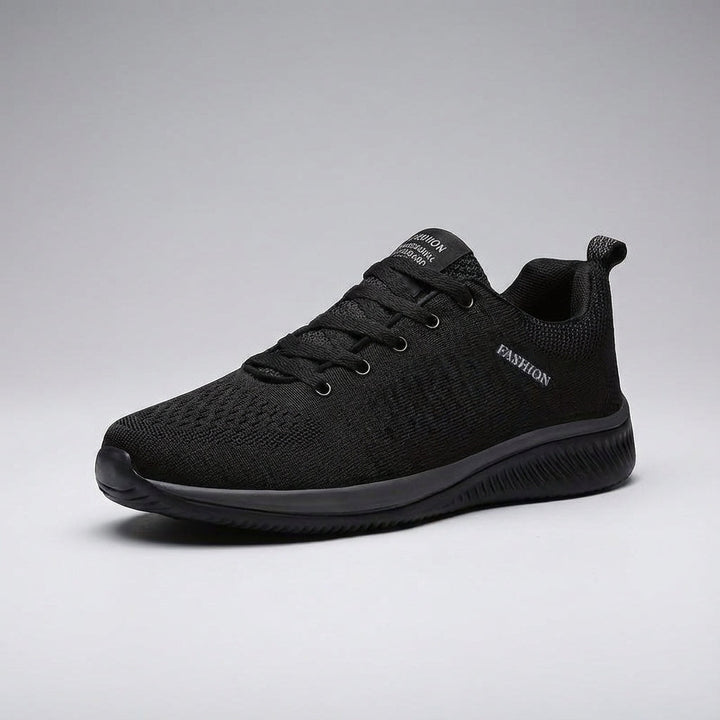 Close-up of breathable mesh upper on men's Dynamic Comfort leisure shoes, showing flexible design