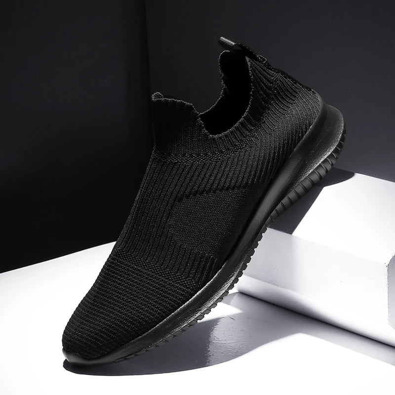 Stylish white men's slip-on runners. Comfortable & lightweight casual sneakers, ideal for walking & daily activities.