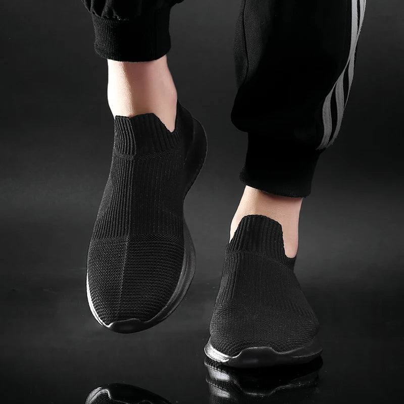 Gray men's comfort slip-on sneakers. Lightweight everyday runners, versatile for walking, casual outfits, & daily activity.