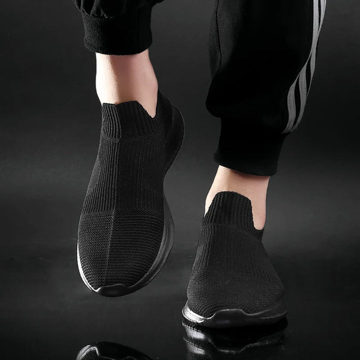 Gray men's comfort slip-on sneakers. Lightweight everyday runners, versatile for walking, casual outfits, & daily activity.