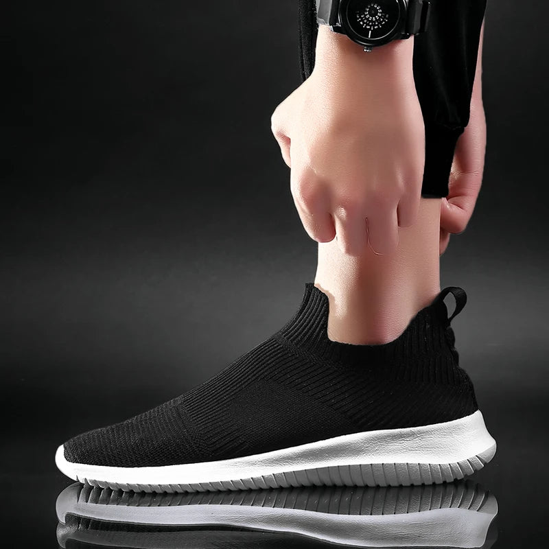Durable men's slip-on casual footwear. Lightweight & comfortable sneakers for everyday wear, walking, and athletic use.