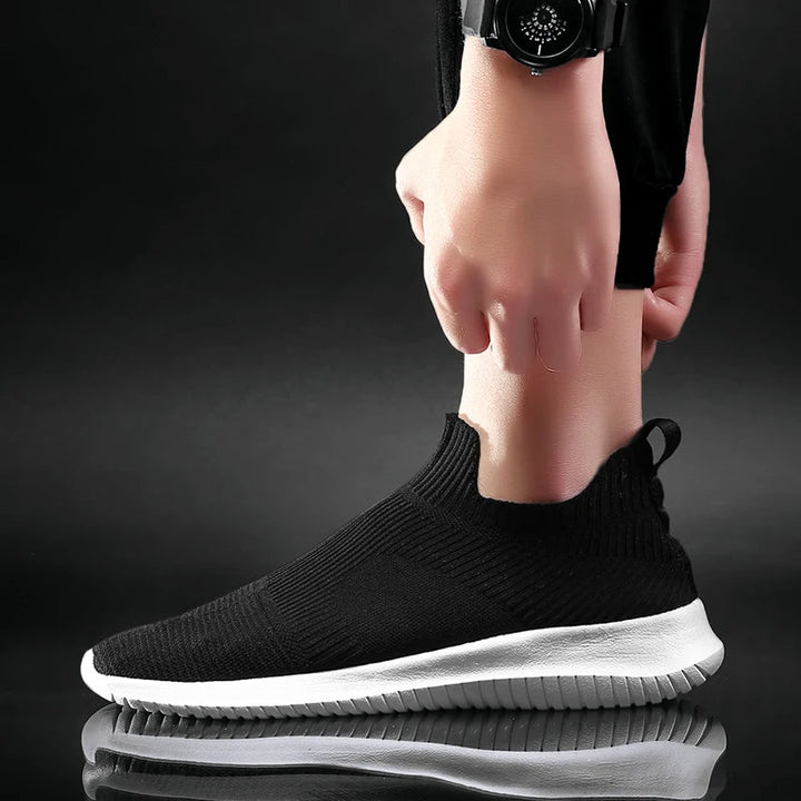Durable men's slip-on casual footwear. Lightweight & comfortable sneakers for everyday wear, walking, and athletic use.