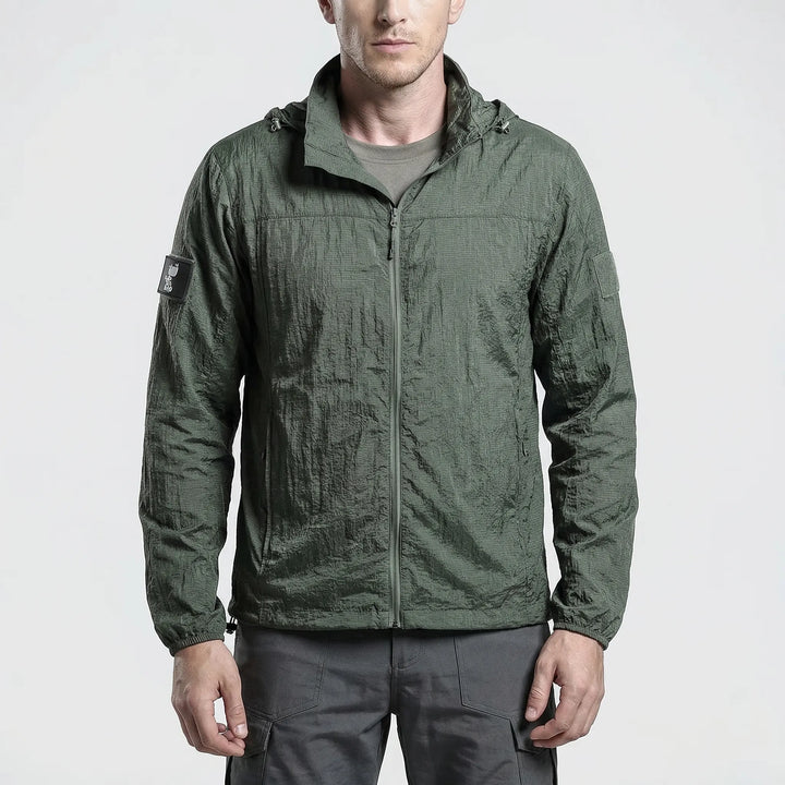 Men's tactical hooded windbreaker for hiking. Lightweight, water-repellent jacket for outdoor activewear.