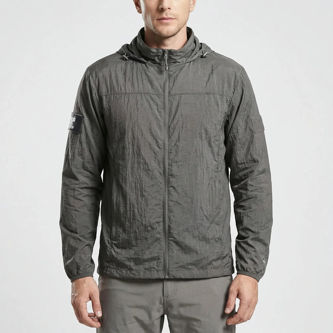 Versatile men's hooded tactical windbreaker. Lightweight, water-repellent jacket for hiking & outdoor activewear.