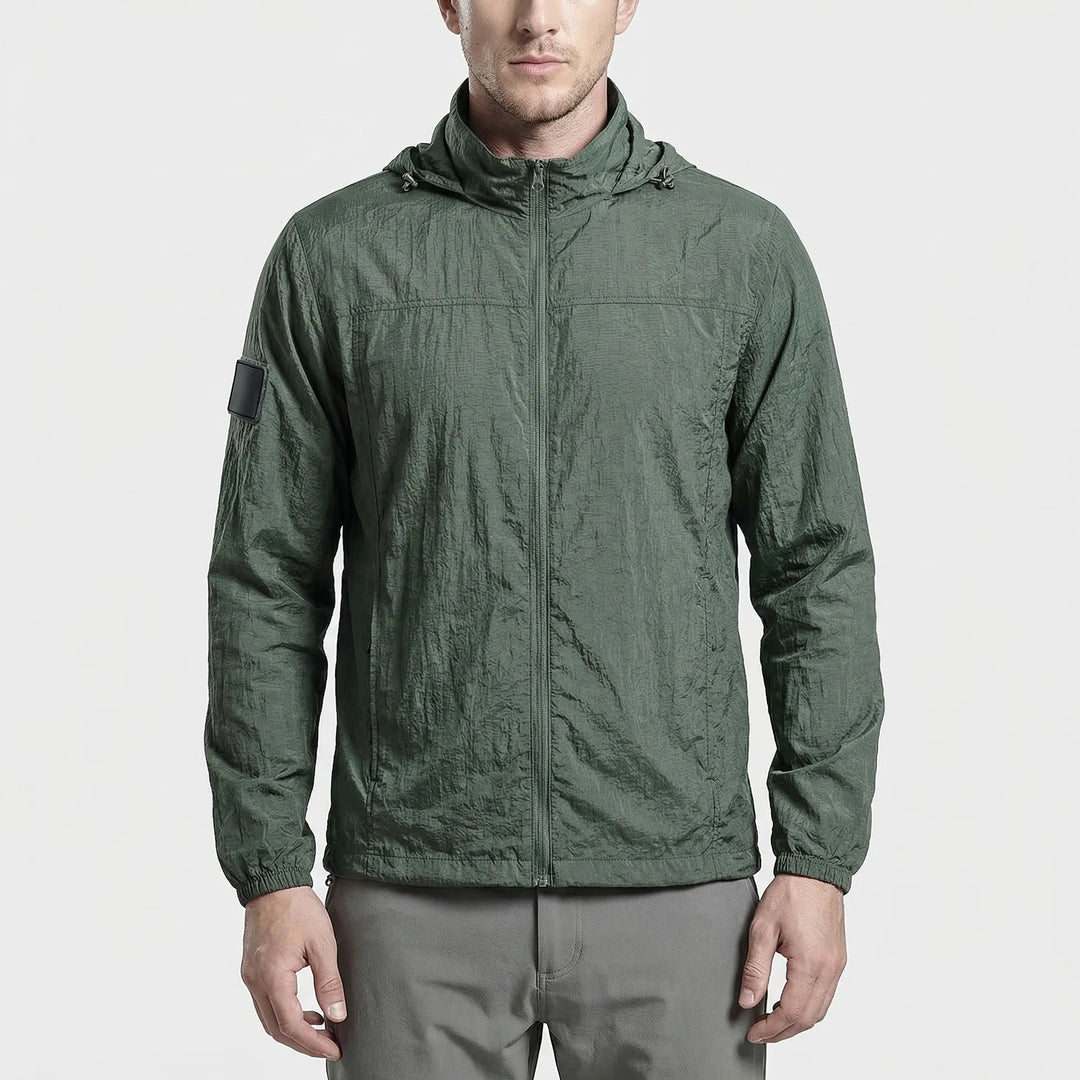 Men's lightweight hooded tactical windbreaker jacket. Water-repellent activewear for outdoor adventures.