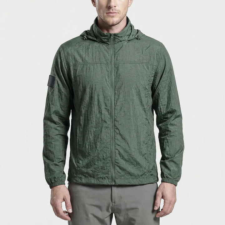 Men's lightweight hooded tactical windbreaker jacket. Water-repellent activewear for outdoor adventures.