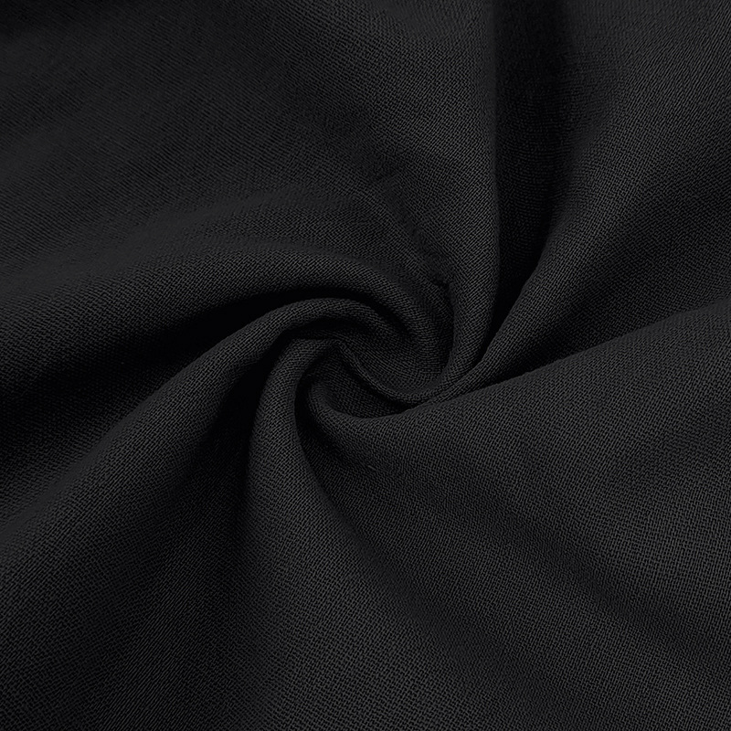 Detail of the collar & buttons on a men's lightweight linen-blend polo shirt. Casual summer style.