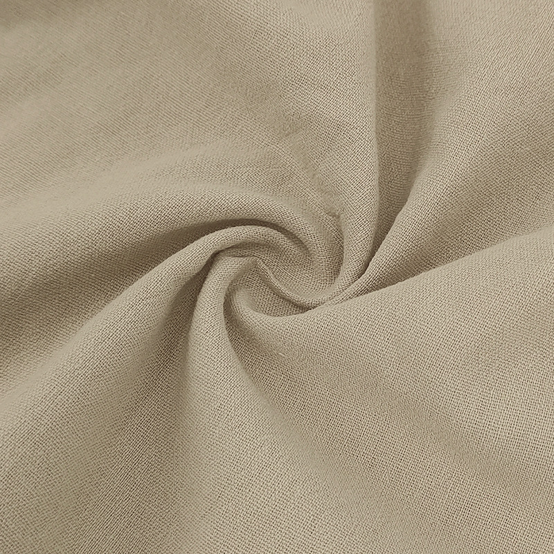 Textured linen-blend fabric on men's lightweight polo set. Breathable summer fashion for comfort.
