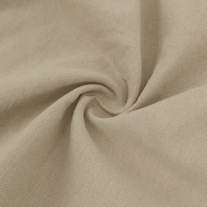 Textured linen-blend fabric on men's lightweight polo set. Breathable summer fashion for comfort.