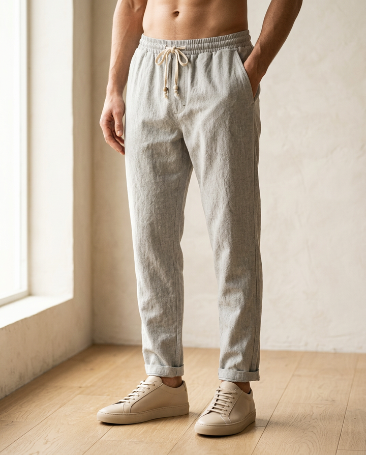 Stylish men's lightweight linen trousers. Comfortable drawstring closure, ideal for casual summer fashion.