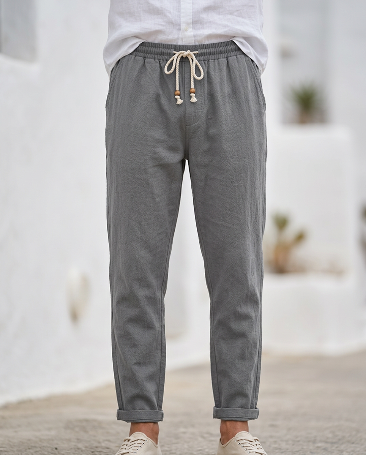 Soft men's linen drawstring trousers. Breathable, relaxed fit, perfect for warm weather comfort.