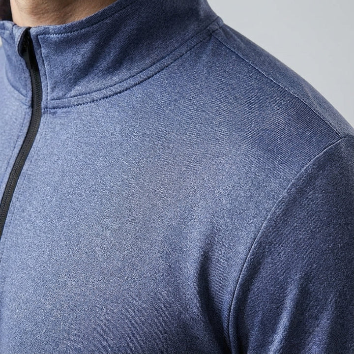 Man running outdoors wearing a lightweight, quick-dry men's long sleeve sports top in black