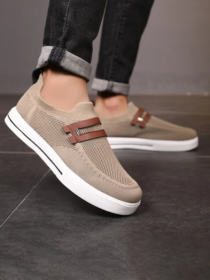 Full view of men's lightweight breathable mesh loafers, offering easy slip-on comfort for casual wear.