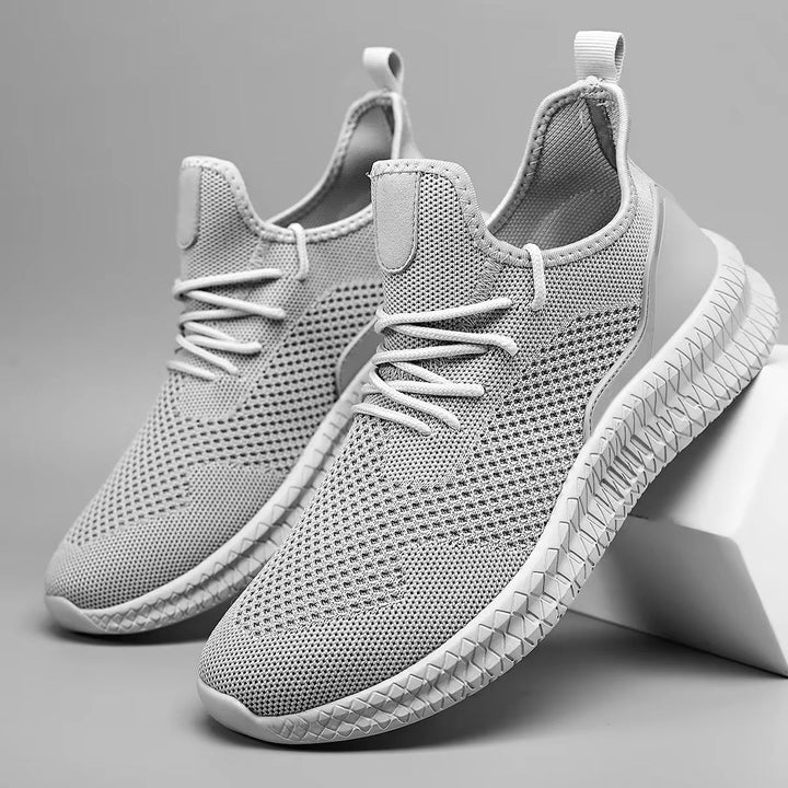 Men's casual athletic sneakers, featuring breathable mesh for lightweight daily comfort.