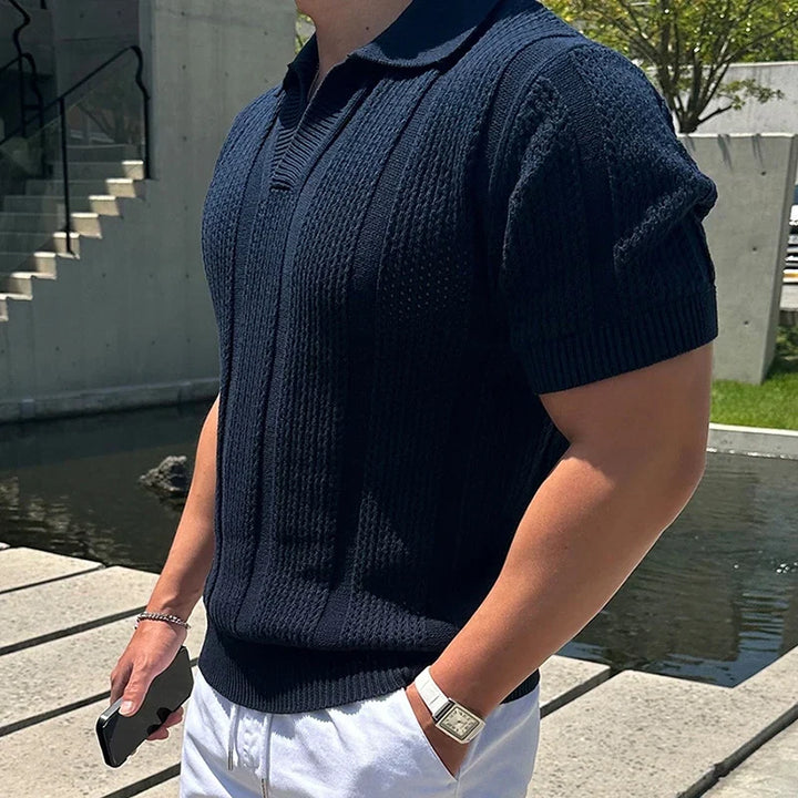 Man wearing a fitted men's lightweight mesh polo shirt, ideal for stylish and breathable summer casual wear.
