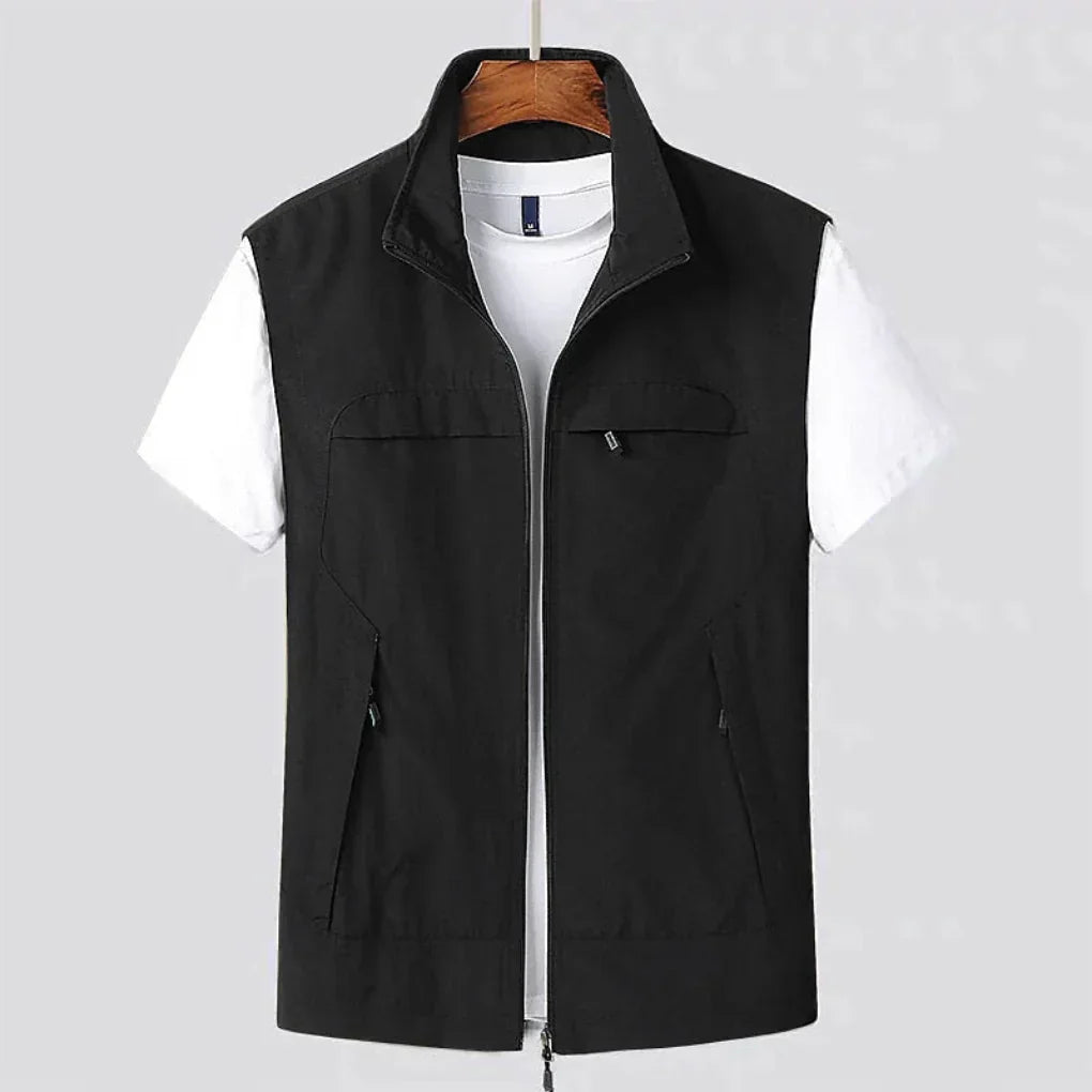Lightweight men's zip utility vest, perfect for active comfort & versatile layering in the outdoors.