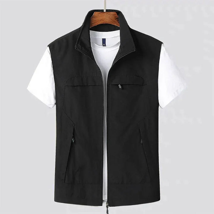 Lightweight men's zip utility vest, perfect for active comfort & versatile layering in the outdoors.