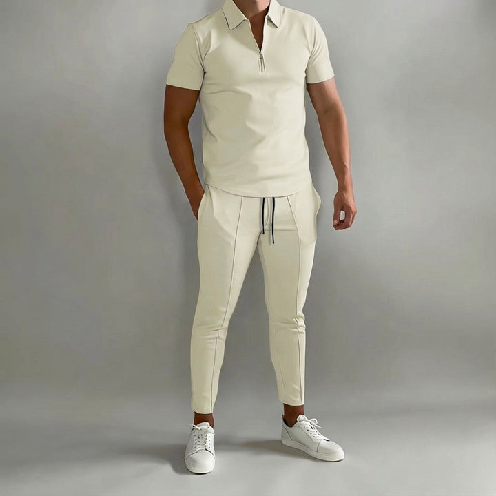 Men's athletic polyester tracksuit in black, designed for training and comfortable spring outdoor activity.