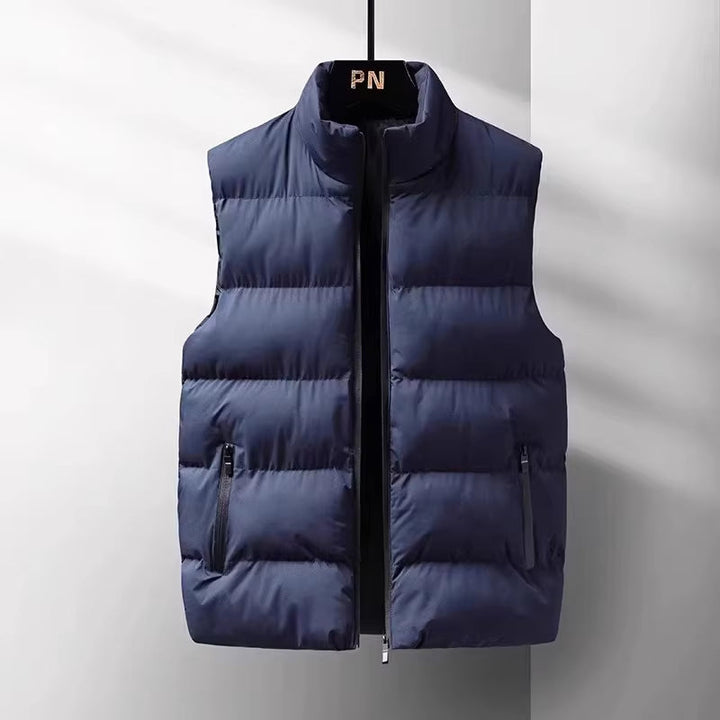 Comfortable men's lightweight puffer vest, an essential layering piece for outdoor activities & sleek casual style.