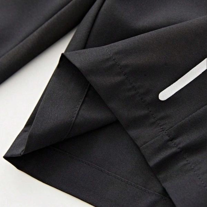 Men's lightweight performance shorts with deep zipper pockets, essential for secure storage during activity.