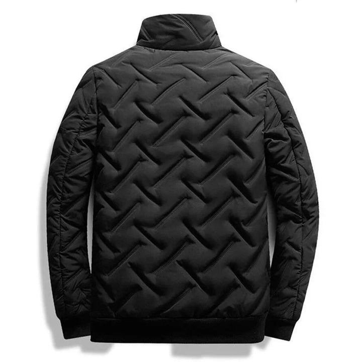Lightweight men's quilted jacket featuring a modern design. Durable outerwear offering comfort fit for casual style.