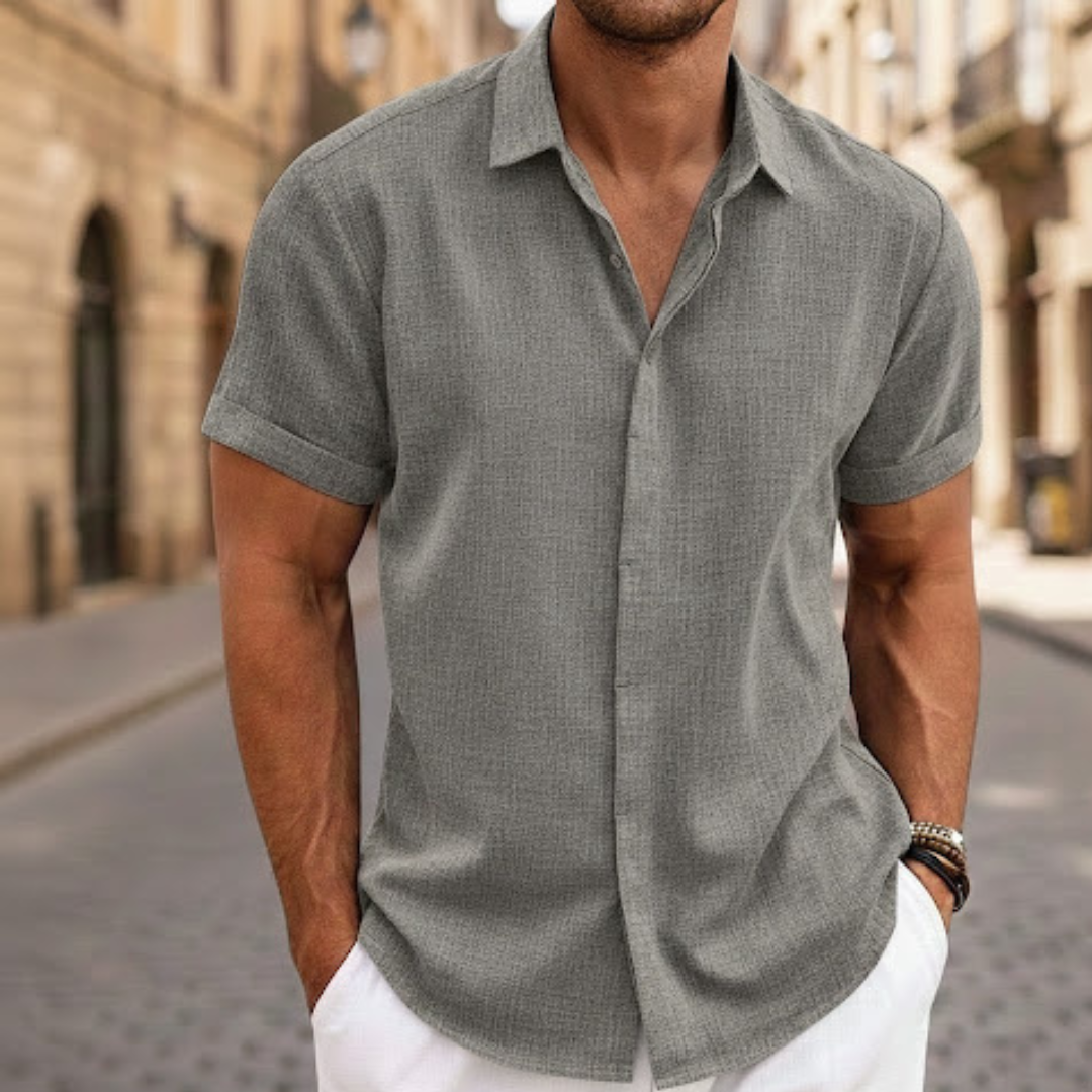 Stylish men's short sleeve button-front polo shirt. Casual, lightweight, and breathable for summer comfort.