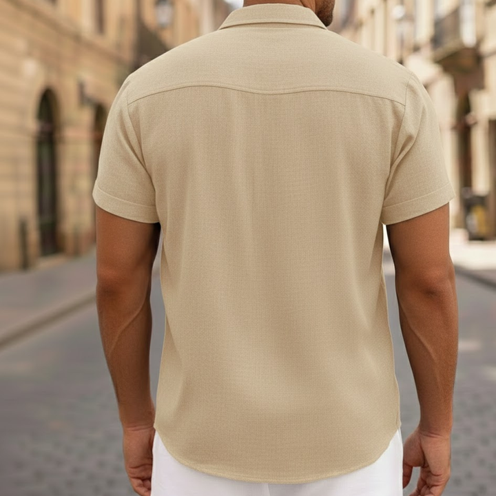 Man enjoying summer in a lightweight short sleeve button-front polo shirt. Ideal for casual fashion.
