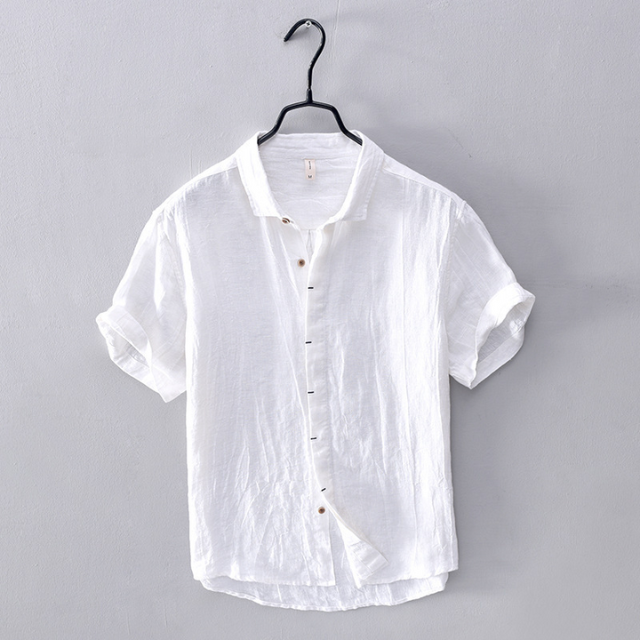 Lightweight men's short-sleeve summer top. Relaxed fit, button-front design. Ideal for casual warm-weather style.