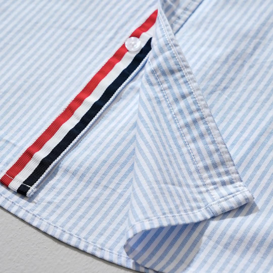 Stylish men's collared button-down shirt, featuring a modern striped pattern and lightweight comfort.