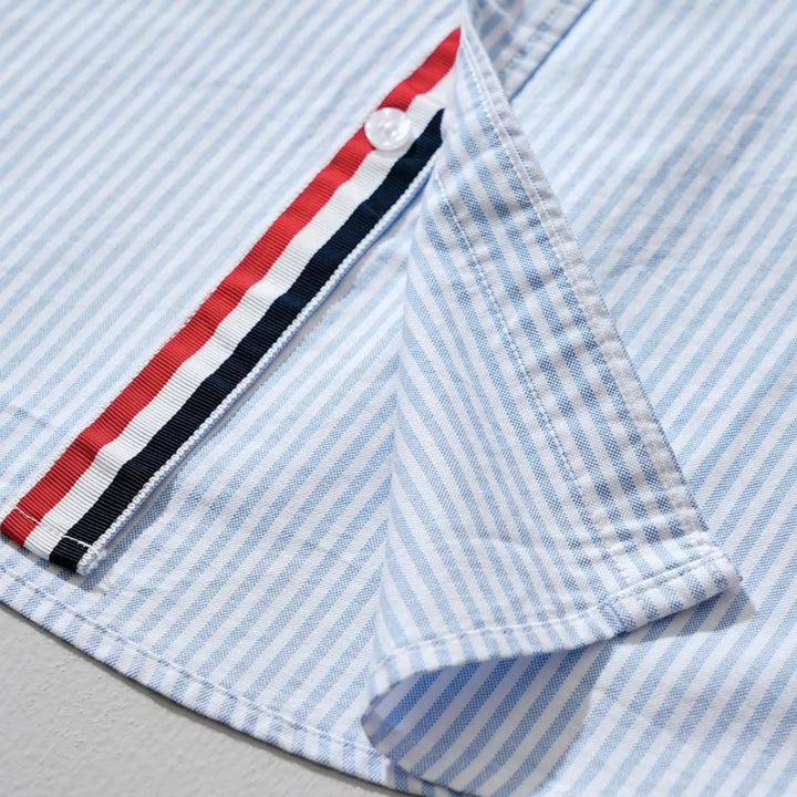 Stylish men's collared button-down shirt, featuring a modern striped pattern and lightweight comfort.