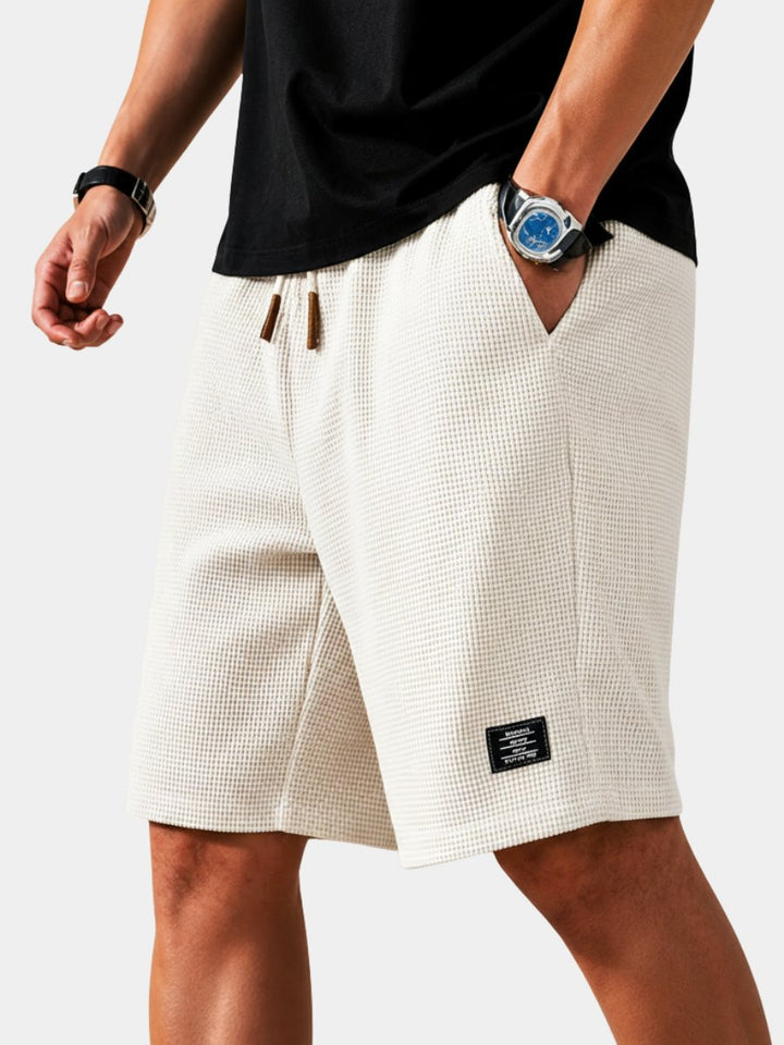 Men's lightweight summer shorts with elastic waist & drawstring for ultimate comfort.