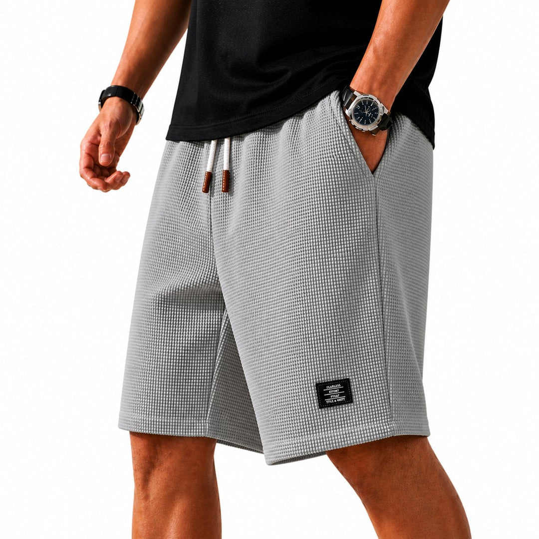 Men's athletic drawstring shorts with elastic waist, designed for summer comfort & outdoor adventures.