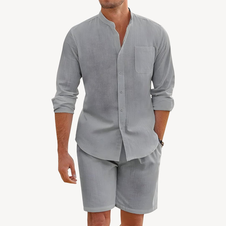 Trendy men's summer fashion two-piece set: a cool button-up shirt and casual drawstring shorts for hot days.