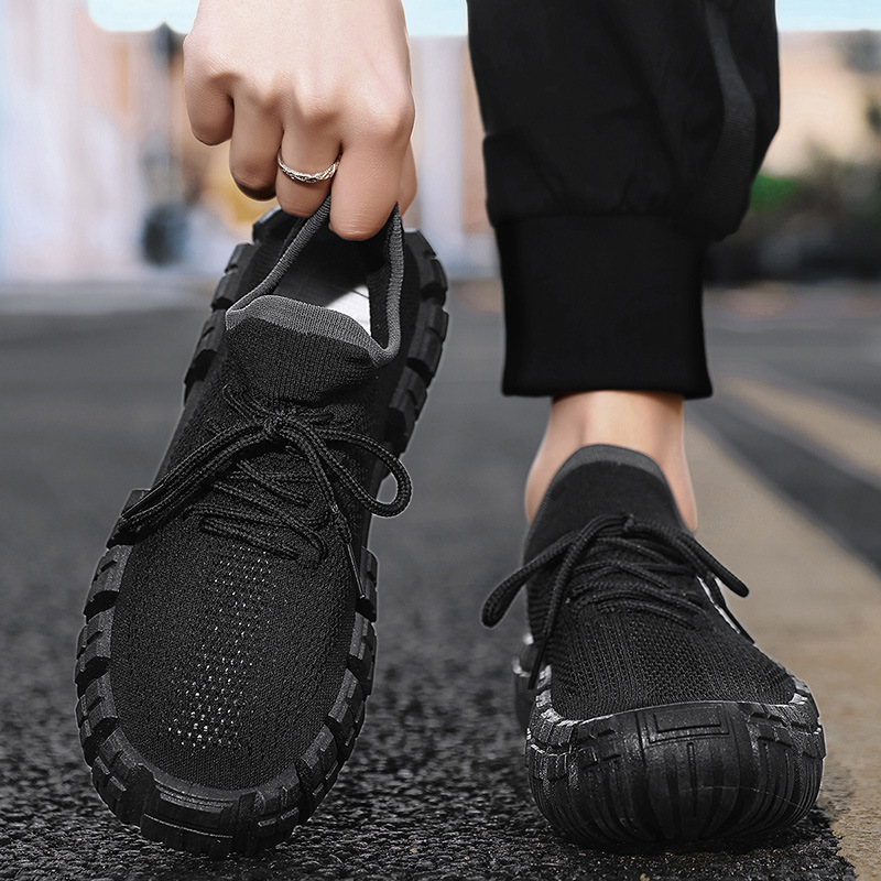 Close-up of breathable mesh material on men's lightweight urban agility sneakers, showing texture.