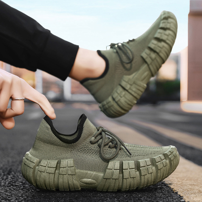 Side profile of a men's lightweight urban agility sneaker in khaki, highlighting sleek design.