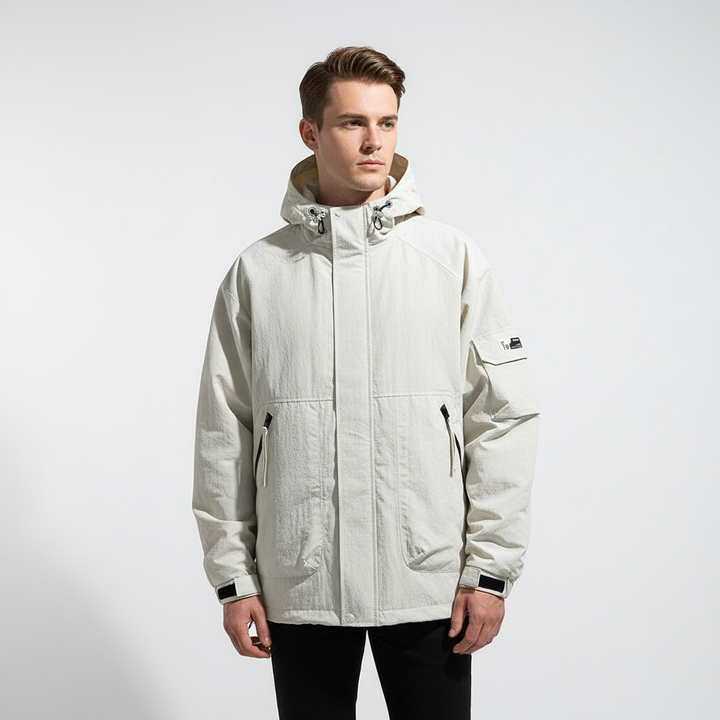 Side view of a dark men's water-repellent outerwear jacket, emphasizing its lightweight design.