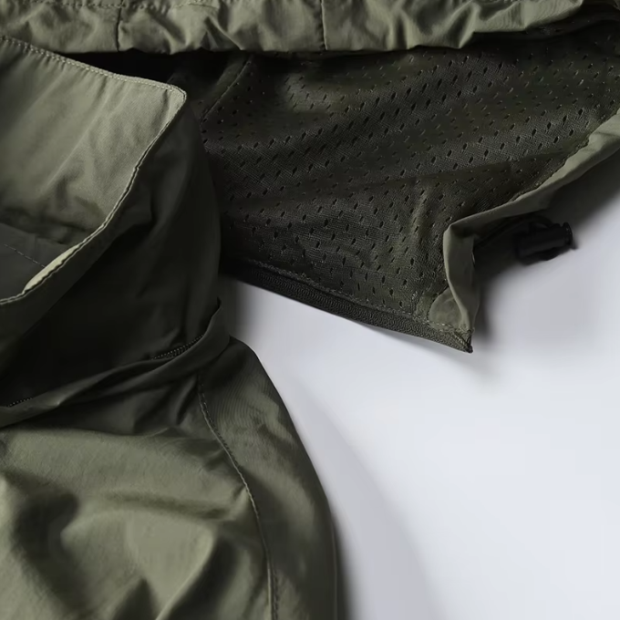 Men's water-resistant outdoor jacket with hood, lightweight for spring/fall adventures.