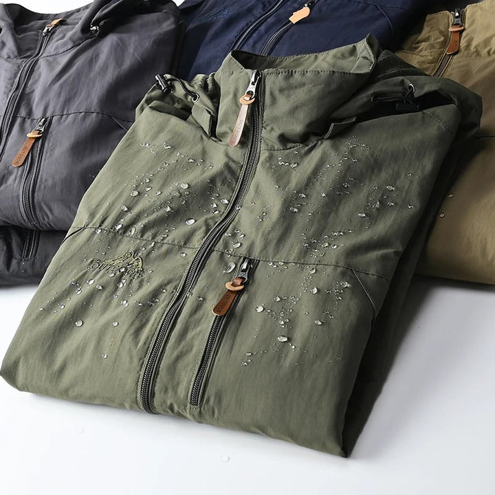 Compact men's travel jacket, lightweight & water-resistant, easy to pack for outdoor trips.