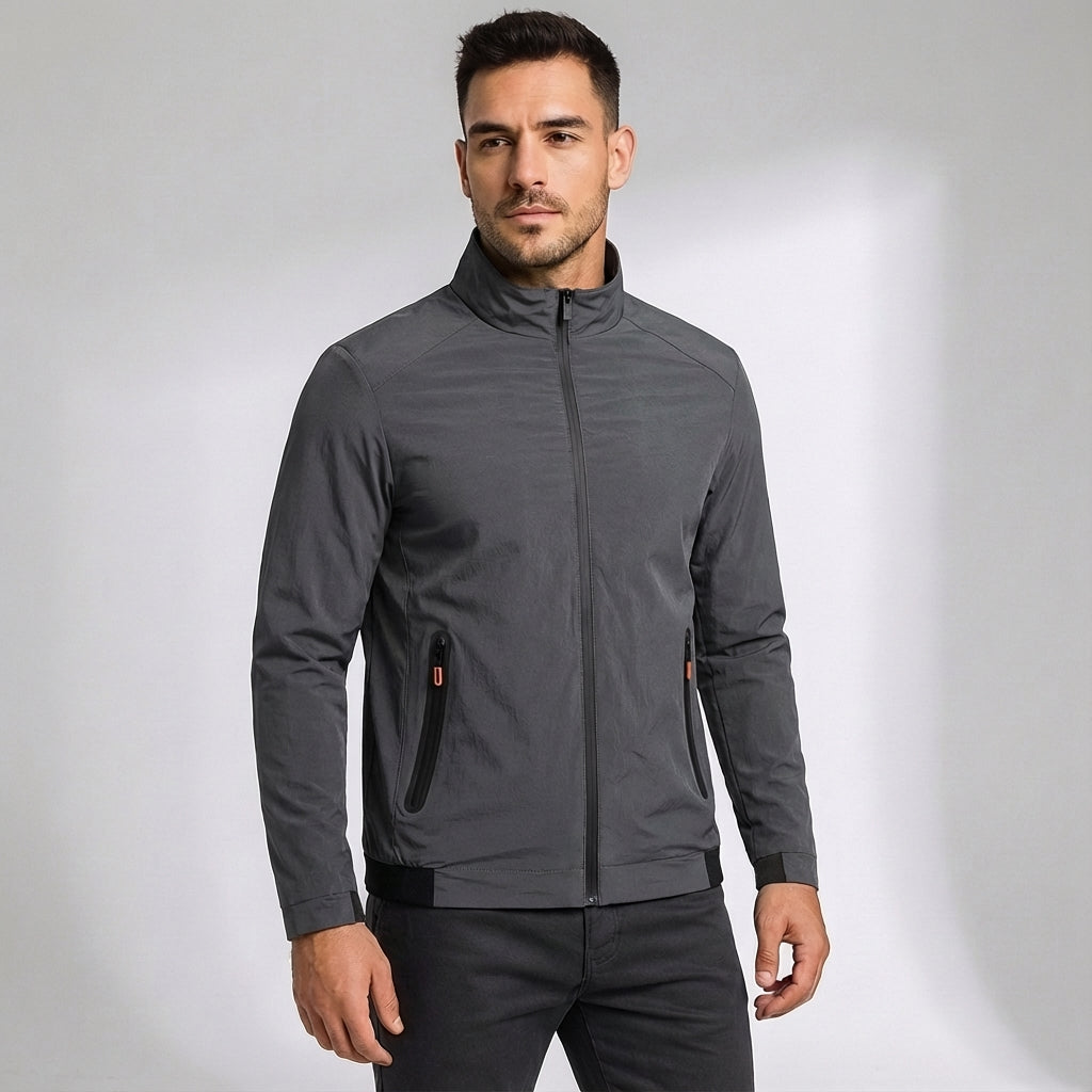 Full-body shot of a man wearing a quickdry windproof sports jacket, suitable for various outdoor activities