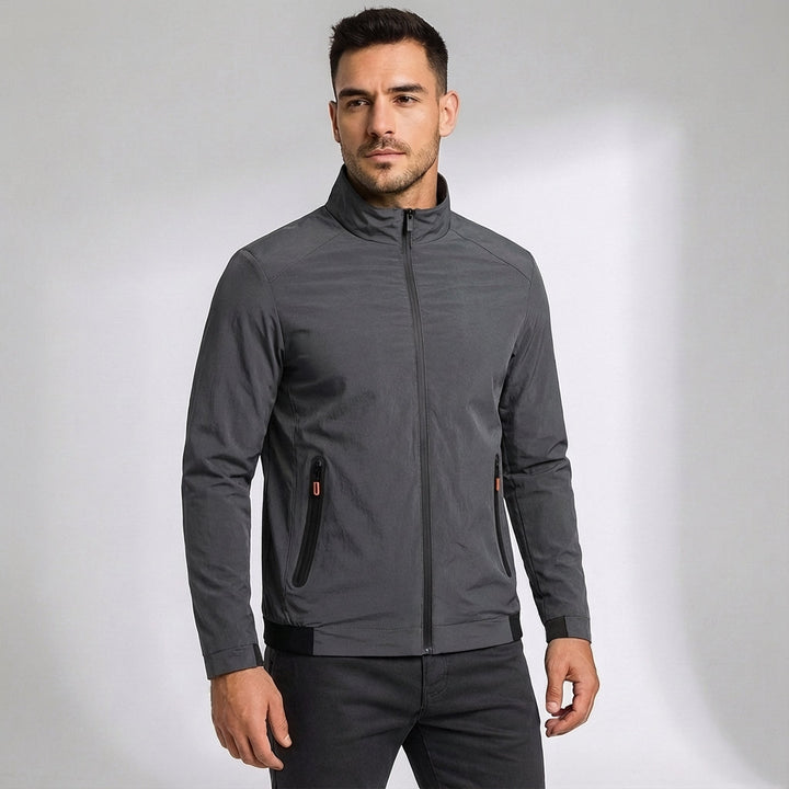 Full-body shot of a man wearing a quickdry windproof sports jacket, suitable for various outdoor activities