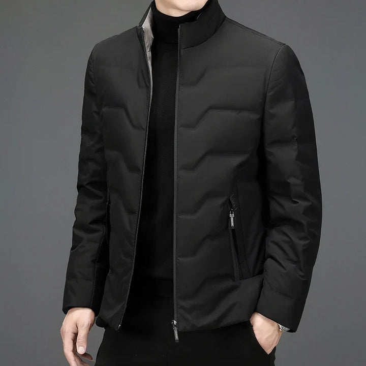 Men's lightweight winter jacket for cold weather. Features a comfort fit and quilted design, perfect everyday outerwear.