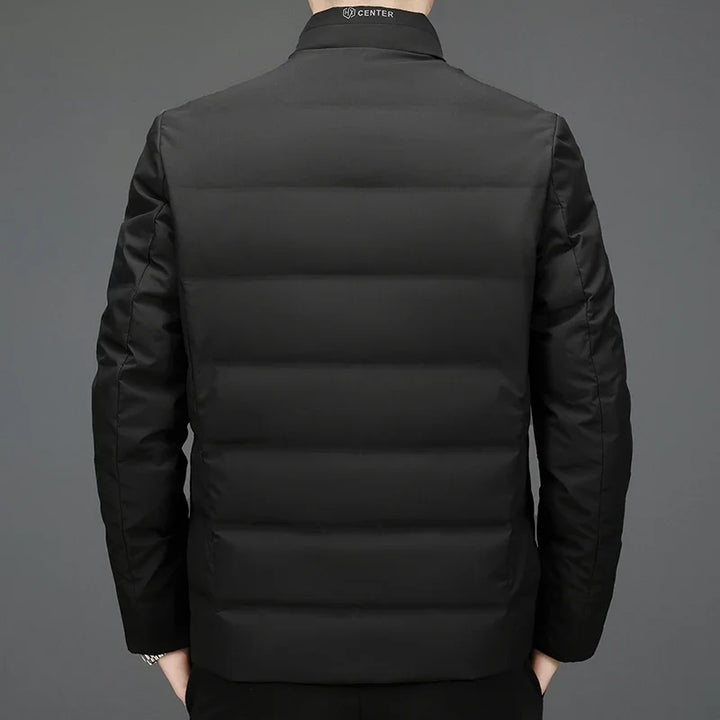 Warm men's quilted winter jacket with zippered pockets. Ideal lightweight outerwear for comfort in cold weather.